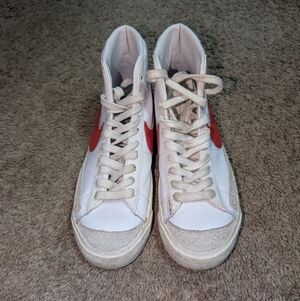 Nike High-Top Sneakers with Red Swoosh